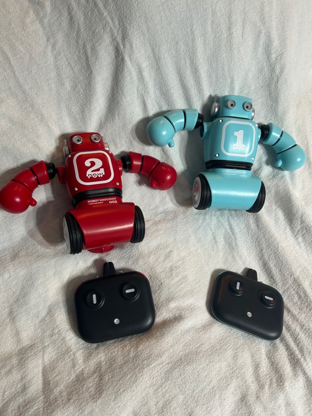 Pair of Remote Control Toy Robots in Red and Light Blue